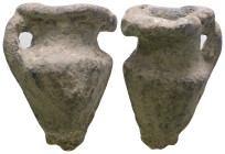 Weight 17,35 gr - Diameter 22 mm. Pilgrim's Holy Water Ampulla with inscription on, 10th-14th century AD. A lead-alloy ampulla with tapering body, fla...