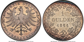 Frankfurt. Free City Gulden 1844 MS65+ NGC, KM331. Nearly semi-Prooflike, a character likely acknowledged by the plus designation, and wearing a soft ...