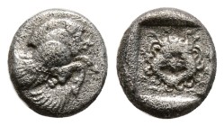 "IONIA. Klazomenai. Obol (Circa 5th century BC). 1,1 g. 9,3 mm.
Obv: Forepart of winged boar right.
Rev: Facing gorgoneion, tongue protruding, withi...