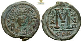 Justinian I Æ 40 Nummi. (35,3 mm, 20.1 g) Constantinopolis, Year 17 = 543/44.Helmeted and cuirassed facing bust, holding globus cruciger and shield; c...