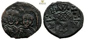 Constantine V, with Leo IV and Leo III. 741-775. Æ follis. Syracuse mint. Struck A.D. 751-775. Constantine V (left) and Leo IV (right)
facing, cross a...