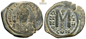 MAURICE TIBERIUS, 582-602. AE Follis, 12,1 g. 34,1 mm.Constantinople Mint, 5th Officina, dated Year 6 (A.D. 587/8). NGC Ch VF.
S-494. Obv: Helmeted an...