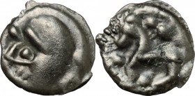 Celtic World. Gaul, Northwest. Senones. Potin Unit, c. 100-50 BC. D/ Stylized helmeted head left; pellet to upper left. R/ Stylized horse left; pellet...