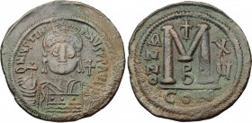 Justinian I (527-565). AE Follis, Constantinople mint. D/ DN IVSTINIANVS PP AVI. Helmeted and cuirassed bust facing, holding globus cruciger and shiel...