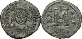 Justinian I (527-565). AE Follis, Nicomedia mint, dated RY32 (558-9 AD). D/ DN IVSTINIANVS PP AVG. Helmeted and cuirassed bust facing, holding globus ...