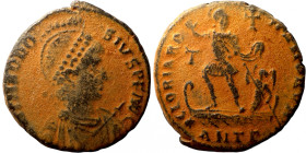 Theodosius I, 379-395. Follis Thessalonica. D N THEODOSIVS P F AVG Pearl-diademed, helmeted, draped and cuirassed bust right, holding spear and round ...