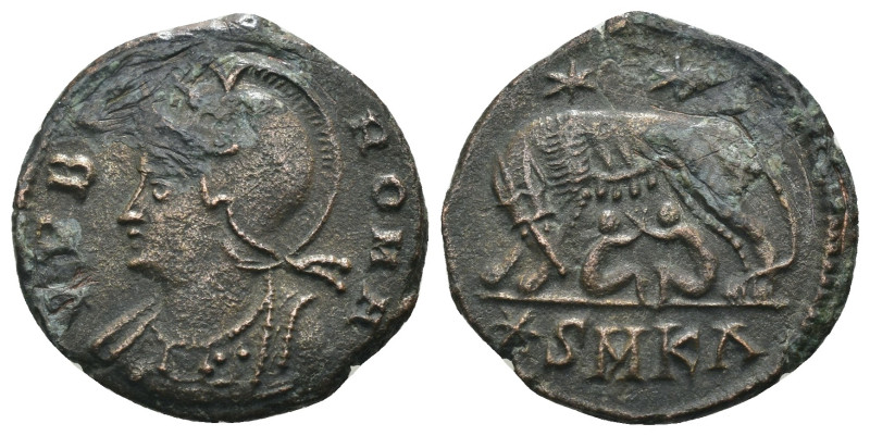 Constantinus I. (306-337 AD). Æ Follis. Cyzicus. Obv: VRBS ROMA. helmeted bust o...