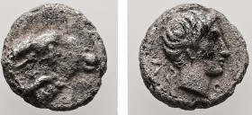 Caria, Kasolaba. AR, Hemiobol. 0.42 g. - 7.12 mm. 4th century BC.
Obv.: Young male head right; Carian letters below chin and behind.
Rev.: Head of ram...