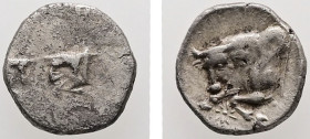 Caria, Uncertain. AR, Hemiobol. 0.34 g. - 6.99 mm. 5th century BC.
Obv.: Confronted foreparts of two bulls.
Rev.: Forepart of a bull to left; between ...