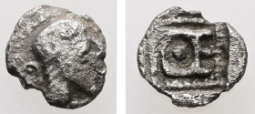 Ionia, Magnesia ad Maeandrum. Themistokles, ca. 465-459 BC. AR, Trihemitartemorion. 0.25 g. - 7.92 mm.
Obv.: Bearded head of Hephaistos to right, wear...