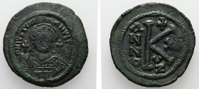 Justinian I. AD.527-565. AE, Half Follis. 10.99 g. - 32.36 mm. Kyzikos mint. Dated RY 20 (AD. 546/7).
Obv.: D N IVSTINIANVS P P AVG. Helmeted and cuir...