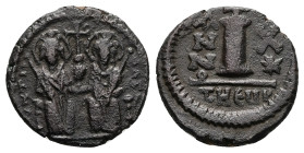 Justin II and Sophia, AD 565-578. AE, 10 nummi. 3.58 g. 18.22 mm. Theoupolis (Antioch).
Obv: Justin left and Sophia right, seated facing on double-thr...