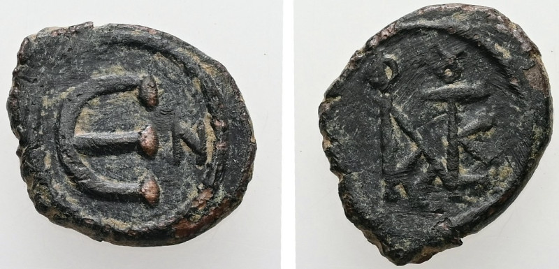 Justin II, AD 565-578. AE, Pentanummium. 1.83 g. 15.39 mm. Constantinople.
Obv: ...