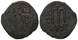 Phocas and Leontia, AD 602-610. AE, Follis. 10.90 g. 32.81 mm. Cyzicus.
Obv: [DN FOCA NЄ PЄ AV]. Phocas standing to left, crowned and holding globus c...