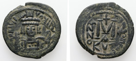 Heraclius, AD 610-641. AE, Follis. 10.60 g. 30.80 mm. Cyzicus.
Obv: Plumed-helmeted and cuirassed bust facing, bearded, holding cross on globe and shi...