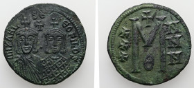 Michael II and Theophilus, AD 820-829. AE, Follis. 8.43 g. 28.88 mm. Constantinople.
Obv: mIXAHL-SΘ-EOFILOS. Michael, with crown and chlamys, short be...