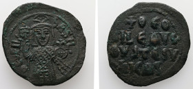 Theophilus, AD 829-842. AE, Follis. 8.69 g. 31.81 mm. Constantinople.
Obv: ΘEOFIL-bASIL. Crowned, three-quarter length figure of Theophilus facing, pe...