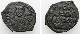 Theophilus, AD 829-842. AE, Follis. 4.07 g. 25.05 mm. Constantinople.
Obv: ΘEOFIL-bASIL. Crowned, three-quarter length figure of Theophilus facing, pe...