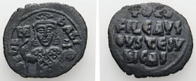 Theophilus, AD 829-842. AE, Follis. 6.05 g. 29.33 mm. Constantinople.
Obv: ΘEOFIL-bASIL. Crowned, three-quarter length figure of Theophilus facing, pe...