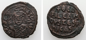Theophilus, AD 829-842. AE, Follis. 6.40 g. 27.76 mm. Constantinople.
Obv: ΘEOFIL-bASIL. Crowned, three-quarter length figure of Theophilus facing, pe...