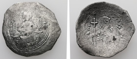 Alexius I, AD 1081-1118. Bl, Aspron Trachy. 3.69 g. 27.03 mm. Constantinople.
Obv: IC-XC to left and right of Christ, nimbate, seated facing, holding ...