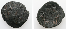 Michael VIII Palaeologus, AD. 1261-1282. AE, Trachy. 2.65 g. 24.29 mm. Constantinople.
Obv.: St. Tryphon, nimbate, standing facing, holding cross in r...