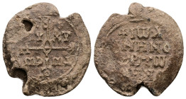 PB Byzantine seal of John Ominos, notarios (AD 9th–10th centuries)
Obv: Cruciform invocative monogram (type V): Θεοτόκε βοήθει. In the quarters: τῷ σῷ...