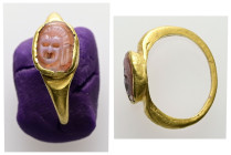 Greco-Roman gold finger-ring with intaglio (AD 1st – 3rd centuries)
Gold finger-ring; raised oval bezel set with a peach/pink carnelian intaglio: thea...