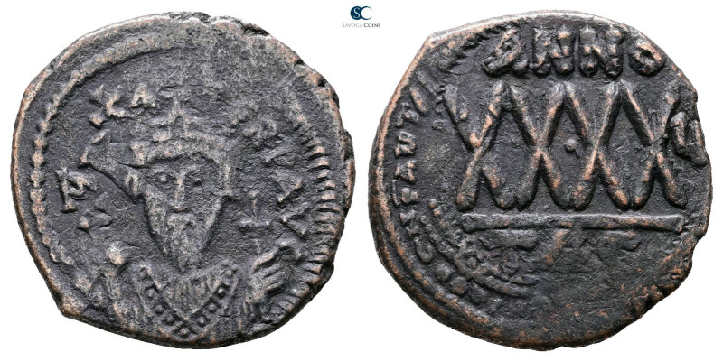 Phocas AD 602-610. Thessalonica
Follis or 40 Nummi Æ

30 mm, 11,99 g



G...