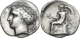 Greek Italy. Bruttium, Terina. AR Drachm, 299-289 BC. Obv. ΤΕΡΙΝΑΙΟΝ. Head of nymph left; behind, triskeles. Rev. Nike seated left in plinth, holding ...