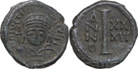 Justinian I (527-565). AE Decanummium. Ravenna mint. Dated RY 36 (562/3). Obv. D N IVSTINIANVS PP AVG. Helmeted and cuirassed bust facing, holding glo...