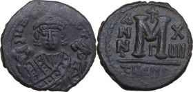 Maurice Tiberius (582-602). AE Follis, Theoupolis (Antioch) mint, dated RY 17 (598-599). Obv. Bust facing, crowned, wearing consular robes, holding ma...