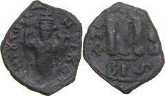 Constans II (641-668). AE Follis, Constantinople mint. Dated RY 1 (641/2). Obv. ЄN TƔTO NIKA. Emperor standing facing, crowned, holding long cross and...