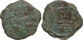 Justinian II. First Reign (685-695 AD). AE Follis. Syracuse mint. Struck 692-693. Obv. Justinian bearded, enthroned facing, wearing crown and chlamys ...