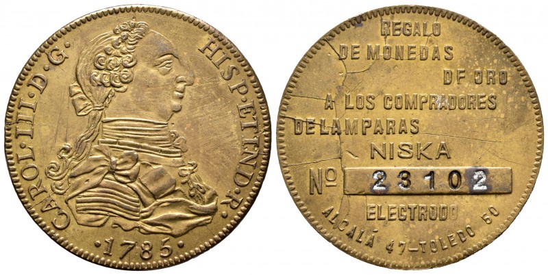 Ficha publicitaria. Madrid. Latón. 19,76 g. "Regalo de monedas de oro a los comp...