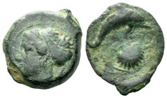 Sicily, Syracuse Hemilitron circa 405, Æ 16.00 mm., 3.72 g.
Head of nymph l., wearing ampyx and sphendone; two leaves behind. Rev. Dolphin swimming r...