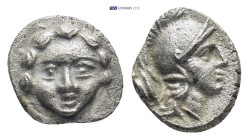 Pisidia. Selge circa 350-300 BC. Obol AR (10mm, 0,93 g) Gorgoneion / Head of Athena to right, wearing crested Attic helmet; behind, astragalos.