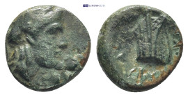 Caria, Knidos. Ae, (1.2 g, 11mm). Circa 250-210 BC. Uncertain magistrate. Obv:Laureate head of Apollo to right Rev: Prow of galley to right; KNI, belo...
