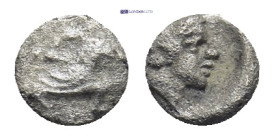 Cilicia, Uncertain. AR Tetartemorion, (0.14 g 5mm). 4th century BC. Obv: Persian king in kneeling-running stance right, holding dagger and bow. Rev: Y...