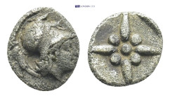 Asia Minor. Uncertain mint. AR, Hemiobol, (6mm, 0.33 g) Circa 500-400 BC. Obv: Helmeted head of Athena right. Rev: Star of four rays, pellets between ...