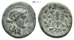 Lydia, Sardeis, 2nd-1st century BC. Æ (14mm, 4.0 g) Obv: Laureate head of Apollo. Rev: Ethnic around club within wreath; monogram to r.
