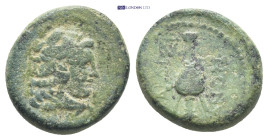 Lydia, Sardes Æ (15mm, 3.7 g). Circa 2nd-1st century BC. Head of Herakles to right, wearing lion skin headdress / ΣAPΔIANΩN, kantharos; monogram to ri...