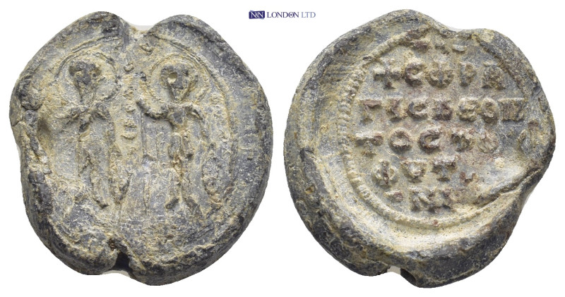 BYZANTINE LEAD SEAL. (18mm, 6.18 g) Obv: A military saint standing facing at lef...