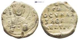 BYZANTINE LEAD SEAL. (18mm, 6.69 g) Obv: Bust of St. Michael holding a sceptre Rev: Legend in 4 lines.