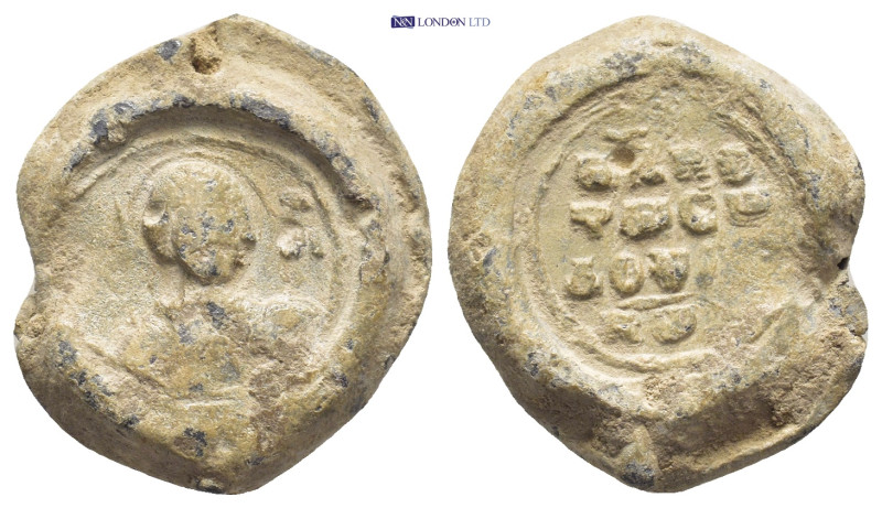BYZANTINE LEAD SEAL. (21mm, 9.1 g) Obv: Nimbate facing bust of Saint George, hol...