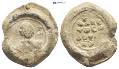 BYZANTINE LEAD SEAL. (21mm, 9.1 g) Obv: Nimbate facing bust of Saint George, holding spear over his right shoulder and shield on his left arm Rev: Leg...