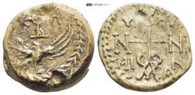 BYZANTINE LEAD SEAL. (23mm, 16.47 g) Obv: Invocative monogram above eagle standing l., head r., with wings spread. Rx: Legend surrounding monogram; si...