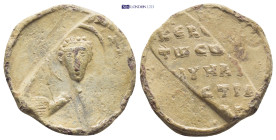 BYZANTINE LEAD SEAL. (24mm, 8.9 g) Obv: Bust of Saint facing. Rev: Legend in 4 lines.