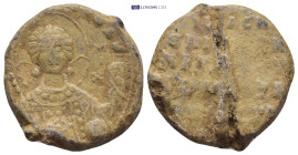 BYZANTINE LEAD SEAL. (25MM, 13.6 G) Nimbate facing bust of Saint George, holding spear over his right shoulder and shield on his left arm. / Greek ins...