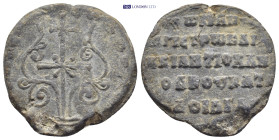 BYZANTINE LEAD SEAL. (25mm, 9.0 g) Obv: Patriarchal cross, with central cross in saltire, set upon base of two steps; floral scrolls around. Rev: Lege...